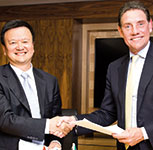 Signing of transaction agreement between Dr Anmin Gao (left), vice president: Hengtong Group, and Robert Venter, chief executive: Altron.